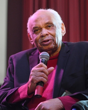 Reginald Petty, civil rights pioneer, speaking into a microphone