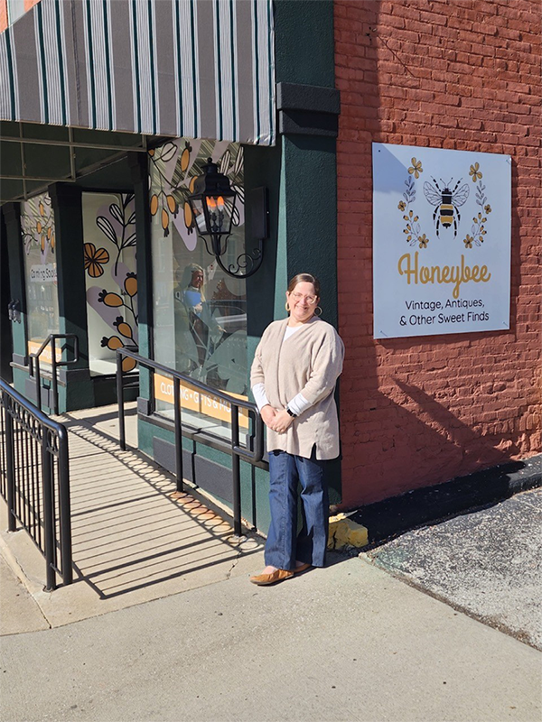 Melissa Bland stands in front of her shop Honeybee Vintage